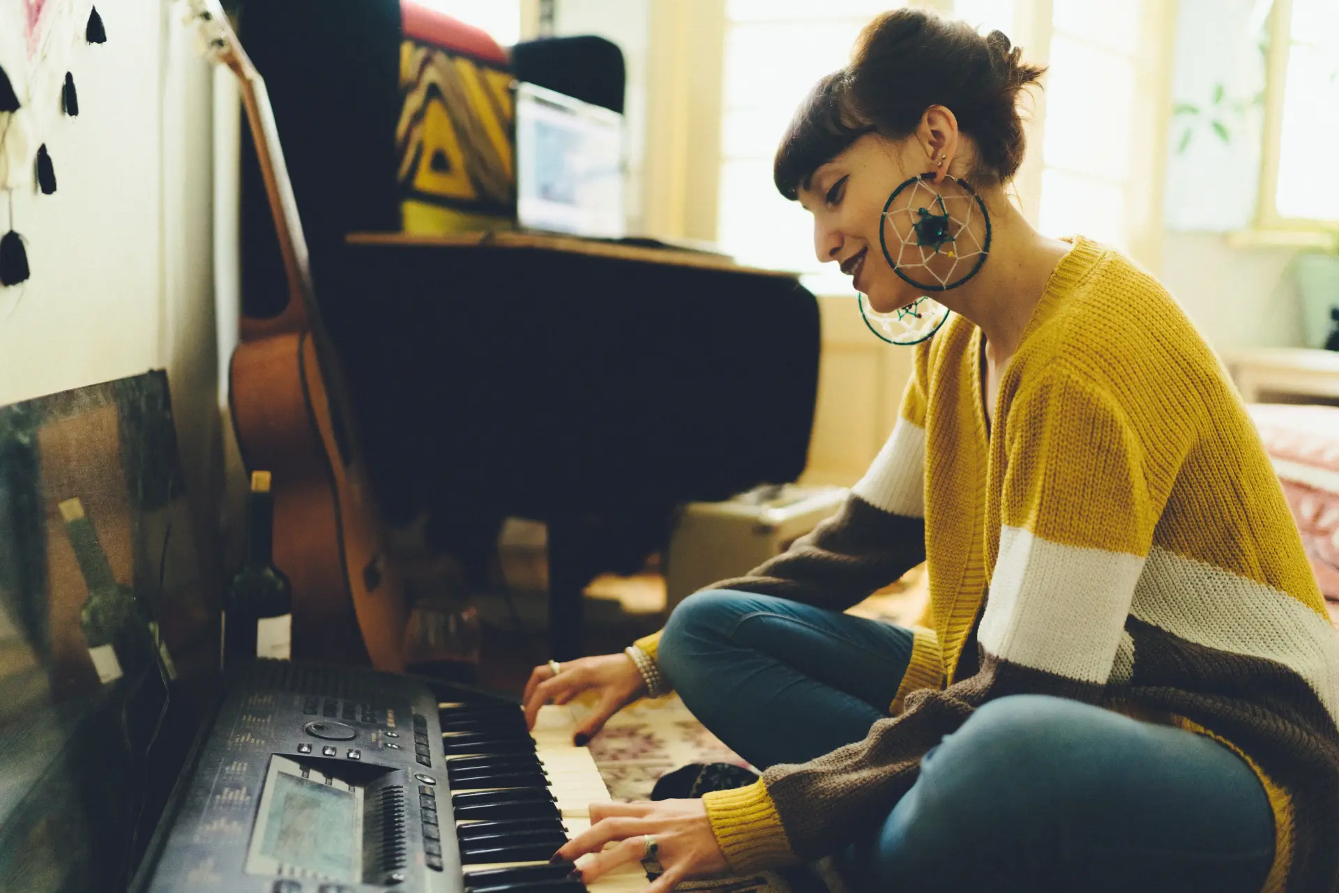 A musician playing a keyboard at home